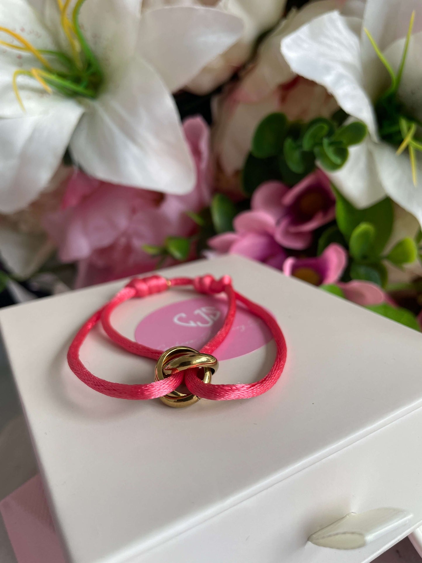 Roze stoffen armband, goud